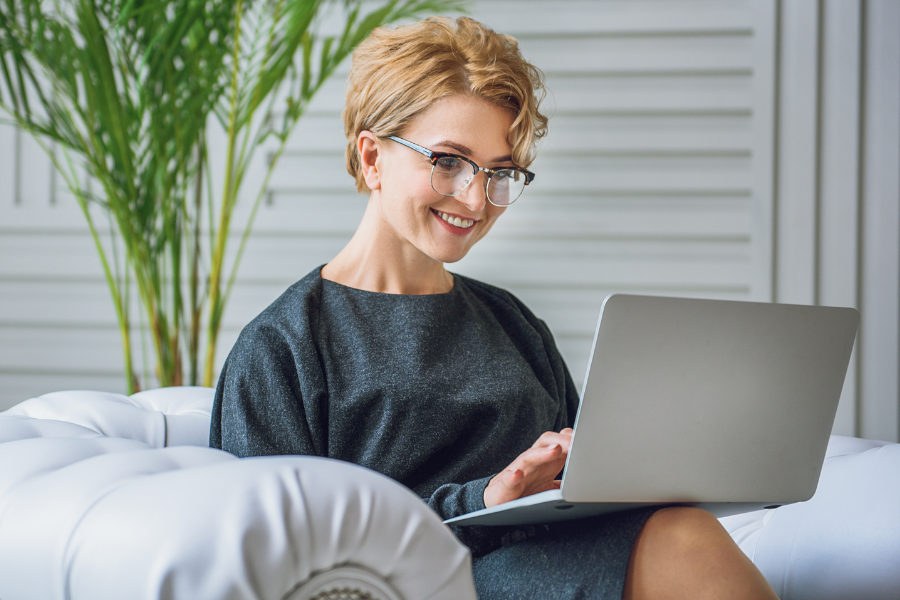 A person on a laptop can access free resources with their library card.