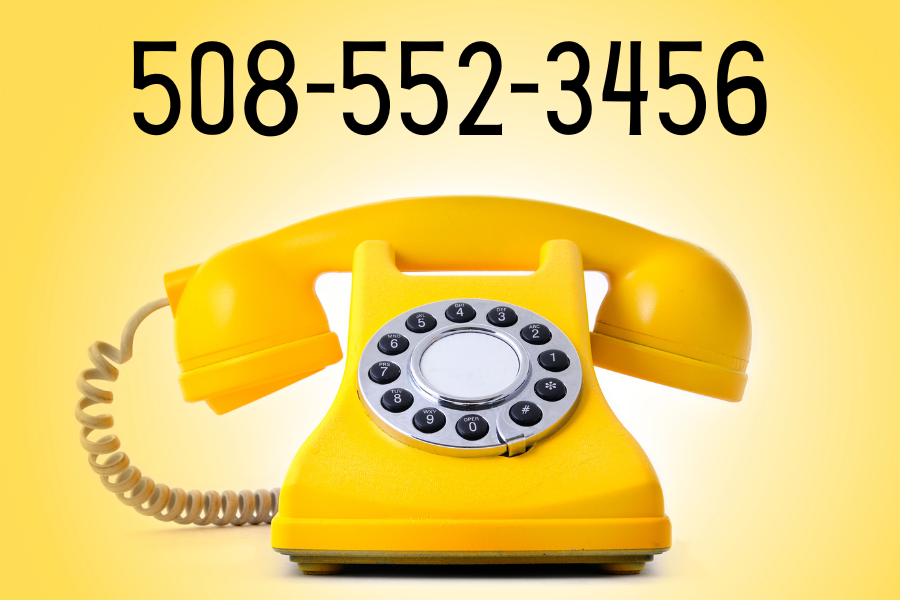 A yellow rotary phone with the phone number 508-552-3456 in black text in the background.