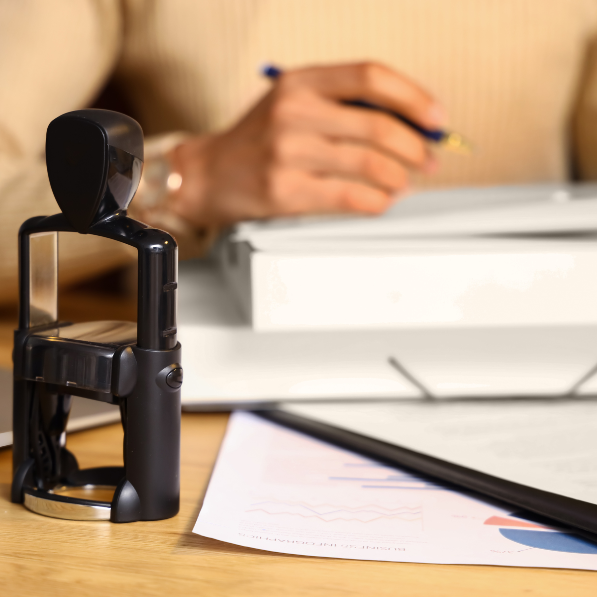Person notarizing documents.