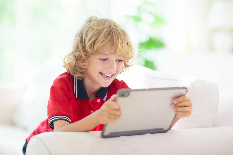 Kid watching a show on tablet.